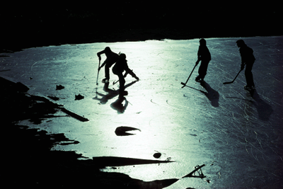 photo of pond hockey at night